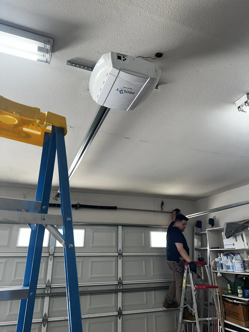 inside garage doing door repair